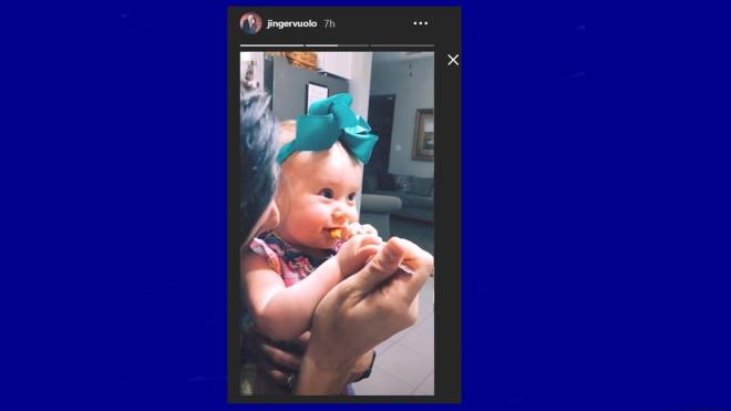 Felicity looks a bit unsure about table-food.
