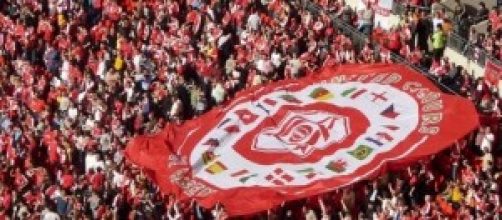 Arsenal football fans with flag