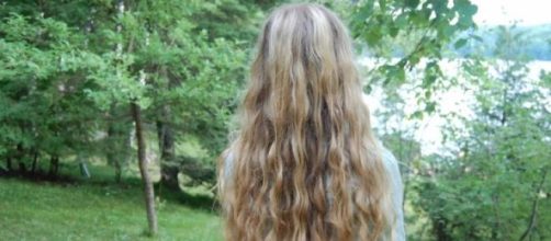 Healthy and curly blond hair