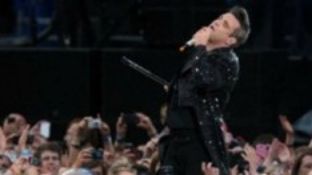Robbie Willians durante una sua performance