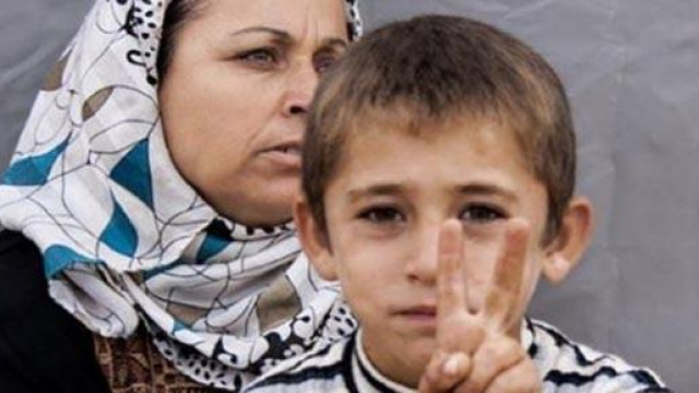 Madre e figlio curdi;vittoria a Kobane contro ISIS