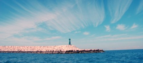 The lighthouse at Pharos attracts refugees