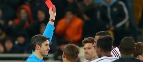 Xabi Alonso gets sent-off in the 65th minute  