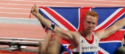 Rutherford winning the Olympic long jump title
