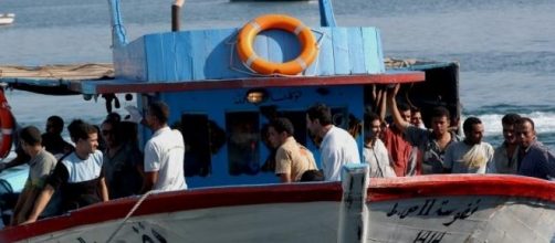 Boat carrying migrants off the coast of Lampedusa