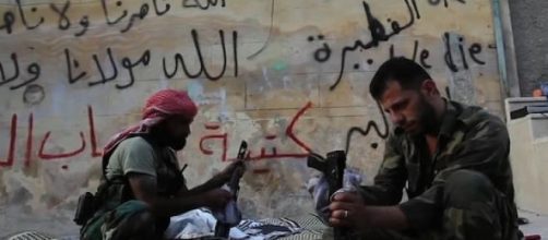 Syria is torn between rebels, Assad, and ISIS.