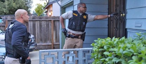 Parole agents conducting Halloween check of sex offender's home. (File Photo provided by, used with consent of California Dept. of Corrections)