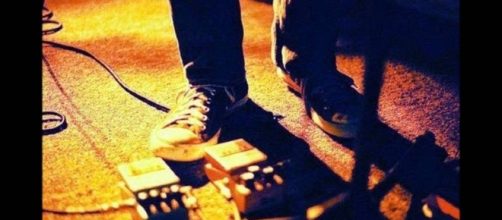 The name itself is derived from guitarists standing motionless on the stage and staring at the floor.