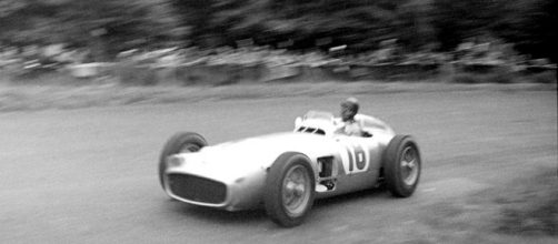 Juan Manuel Fangio in a Mercedes, 1954; picture by Agridecumantes (Wikimedia Commons).
