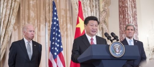 Chinese Pres. Xi Jinping delivers remarks at State Dept. with John Kerry (R) and VP Biden. State Department photo, public domain.