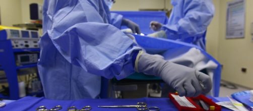 Surgeons performing surgery/Photo via Pixabay, public domain