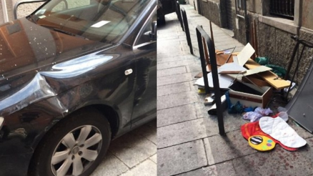 Un'auto danneggiata e gli oggetti lanciati dalla finestra.