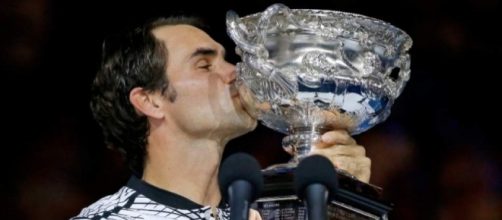 A happy Federer with his 18th Grand Slam trophy / Photo from 'Salt lake Tribune' - sltrib.com