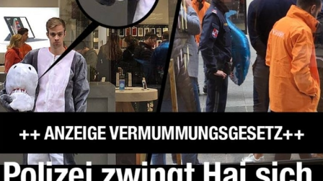 Un promoter vestito da squalo &egrave; stato fermato dalla polizia viennese e multato per effetto della nuova legge antiburqa. Foto: Facebook.