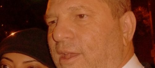 Harvey Weinstein posing for photo with fan [Image Credit: GabboT/Flickr]