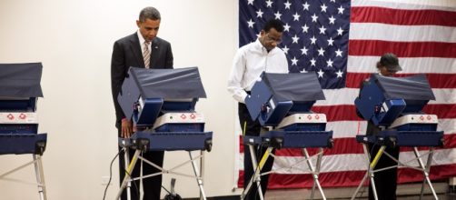 Former President Barrack Obama casts his vote during a past election. [image credit: Pete Souza/Wikimedia commons]