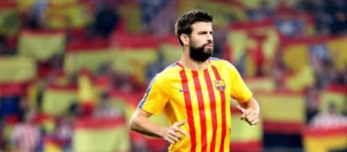 Piqu&eacute; calentando en el Metropolitano