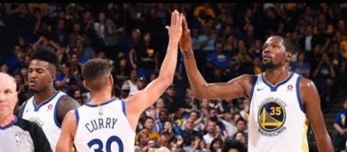 The Golden State Warriors begin their championship defense on Tuesday night when they host the Houston Rockets. [Image via NBA/YouTube]