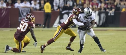 Marshawn Lynch running down the field - Image by Keith Allison via Wikimedia Commons