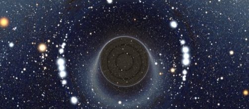 An illustration of a Wormhole is space. (via Alain r/Wikimedia Commons)