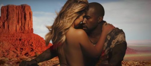 The couple's security team reportedly pulled guns on the intruder. [Image via KanyeWestVevo/YouTube screencap]