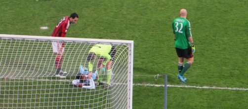 Lazio player on the ground injured in a past match. [Image Credit: Santosh Venkataraman/Flickr]