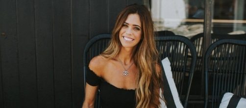 Lydia McLaughlin poses in a Chanel necklace. [Photo via Facebook]