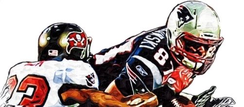 New England Patriots Rob Gronkowski - Tampa Bay Buccaneers Elbert Mack [Image by Jack Kurzenknabe|Flickr| Cropped | Public Domain Mark 1.0 ]