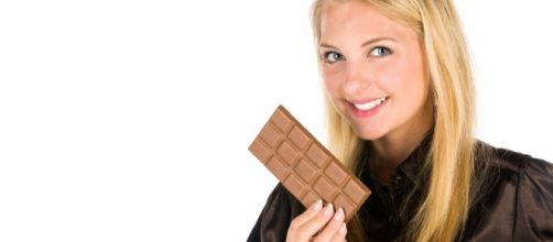 Woman and chocolate- Petr Kratochvil via PublicDomainPictures.net