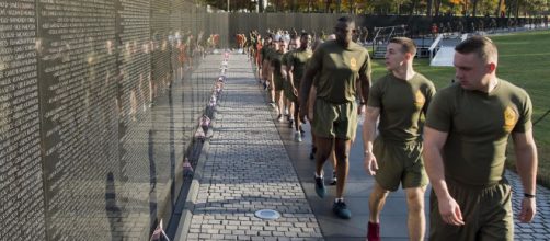 Marines at Vietnam Memorial paying respect. [image source: Defense.gov]