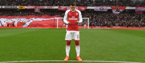 Arsenal Mesut Ozil in a past match (image via Stuart MacFarlane/Flickr)