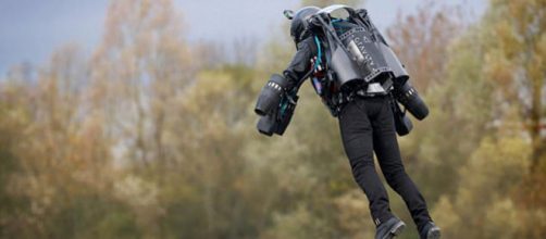 Richard Browning flying over lake. [Image Credit: Daily Mail]