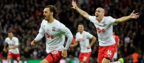 Southampton striker Manolo Gabbiadini (in front) celebrates with Oriol Romeu in a past match. (Image Credit: Indolivescore/Flickr)