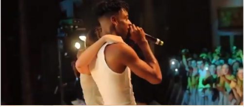 Rapper 21 Savage performing his song, 'Bank Account,' with a fan at his Detroit show. - [Image via dirtyglovebastard/Instagram screencap]