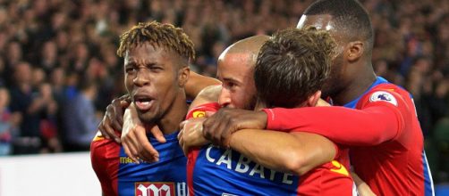Crystal Palace players celebrate a goal in a game that they beat Arsenal 3-0 in the past. (Image Credit: Richard Fisher/Flickr)