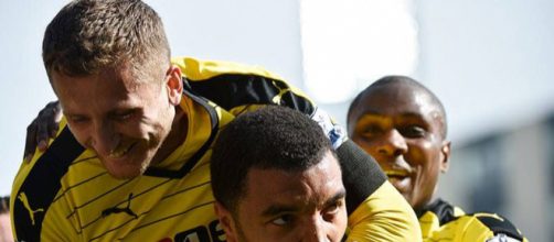 Watford players celebrate Troy Deeney's goal in the past. (Image Credit: MekyCM/Flickr)