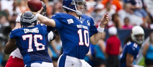 Eli Manning during 2013 Pro Bowl [image source: Tech. Sgt. Michael Holzworth / Wikimedia Commons]