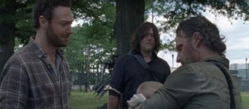 Rick gives baby Gracie to Aaron [Photo via Daryl Dixon, YouTube screencap]
