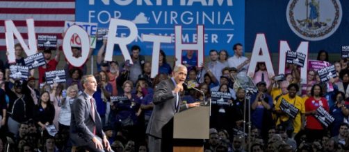 Barack Obama (R) speaks as he campaigns for Democratic gubernatorial candidate...Alex Wong