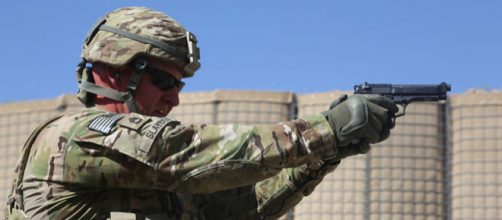 US military man firing a M9 Beretta pistol (Image credit - Chenee Brooks. Wikimedia Commons)