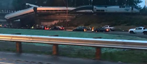 Photo of the derailed Amtrak 501 that dangles over Interstate 5. - CNN