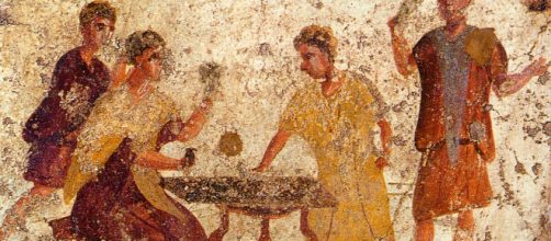Saturnalia revelers [Image via Pompeii/Wikipedia]