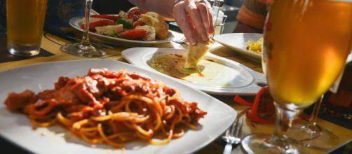 A server dishes some truth to restaurant diners (photo via Pexels)