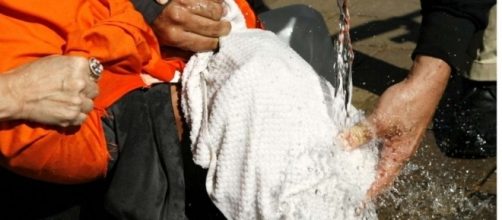 Protesters reinacting waterboarding outside Justice Department / Photo by Manuel Balce Ceneta via Blasting News library