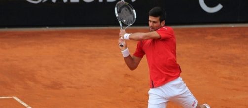 Novak Djokovic plays a backhand. Photo by Marianne Bevis -- CC BY-ND 2.0