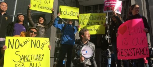 Protesters against Trump's harsh approach on immigration outside a court in San Francisco (Haven Daley/Associated Press)
