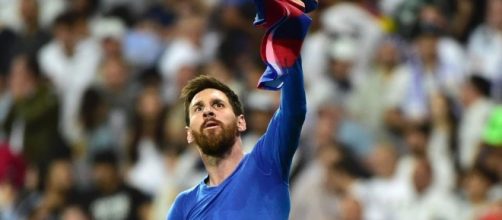 Lionel Messi celebrating after scoring his 500th goal and winning for Barcelona / from 'Hindustan Times' - hindustantimes.com