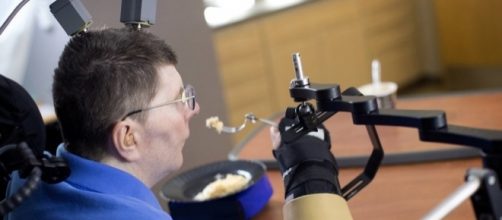 A paralyzed man uses his thoughts to move his hands - npr.org