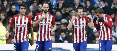 Augusto, Juanfran, Koke y God&iacute;n celebran un gol