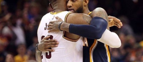 LeBron James and Paul George hug after battle... - www.facebook.com/MJOAdmin